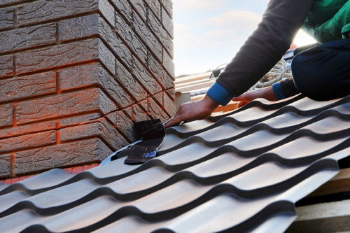 close up of a roofer repairing a roof durnham nc