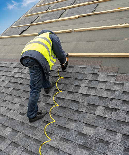 roofer on a roof repair durnham nc